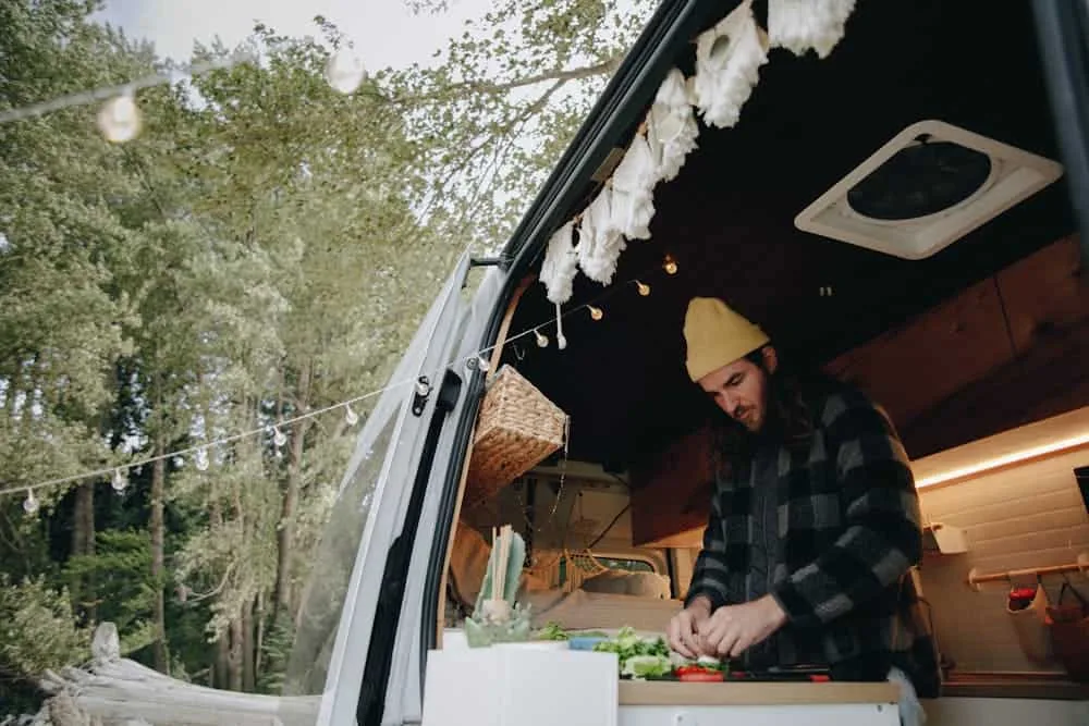 Why Having A Water Filter For Rv Travel Matters: Everything You Need To Know About Water Filtration Systems 1 man in black and gray checkered dress shirt standing beside white truck, water filter for rv importance in food prep